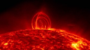 This pictures shows a towering loop of plasma rising over the Sun and raining down on its surface! Credit: NASA/SDO