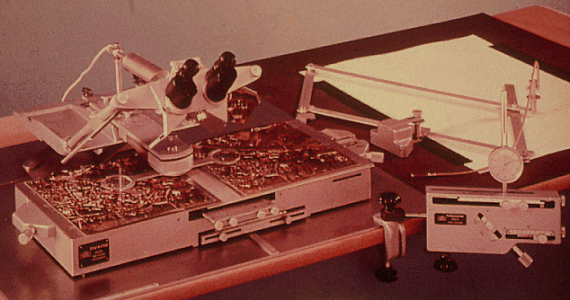 I'm having a heck of a time finding a photo of such a machine that would have been used by craer mappers of the 1960s and 70s. But this is a Stereotop analog stereo plotter from Zeiss in the 1950s, so it gives you a vague sense!