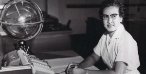 Katherine Johnson sits at her desk with a globe, or "Celestial Training Device."  Credits: NASA