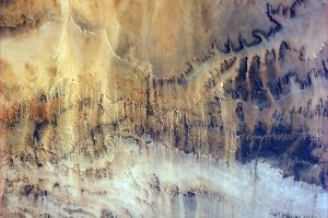 Expedition 40 Flight Engineer Alexander Gerst of the European Space Agency posted this photograph of windswept valleys in Northern Africa, taken from the International Space Station, to social media on July 6, 2014. Astronauts aboard the International Space Station (ISS) regularly photograph the Earth from their unique point of view located 200 miles above the surface. These photographs help to record how the planet is changing over time, from human-caused changes like urban growth and reservoir construction, to natural dynamic events such as hurricanes, floods and volcanic eruptions. Image Credit: Alexander Gerst/ESA/NASA