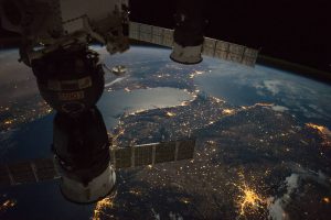 Expedition 49 crew members capture a nighttime view of the Strait of Gibraltar with a Russian Soyuz spacecraft (left) and Progress spacecraft (right) in the foreground. Credit: NASA