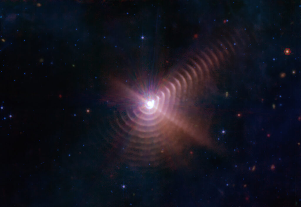 Binary Stars Shape Dust into Rings