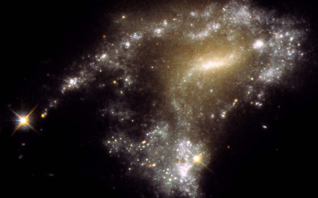 Galaxy Collision Releases Bubbles of Star Formation