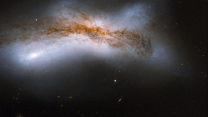 1 ⁄ 2
More details
NGC 520 is the product of a collision between two disk galaxies that started 300 million years ago. It exemplifies the middle stages of the merging process: the disks of the parent galaxies have merged together, but the nuclei have not yet coalesced. It features an odd-looking tail of stars and a prominent dust lane that runs diagonally across the center of the image and obscures the galaxy. NGC 520 is one of the brightest galaxy pairs on the sky, and can be observed with a small telescope toward the constellation of Pisces, the Fish, having the appearance of a comet. It is about 100 million light-years away and about 100,000 light-years across. The galaxy pair is included in Arp's catalog of peculiar galaxies as Arp 157. This image is part of a large collection of 59 images of merging galaxies taken by the Hubble Space Telescope and released on the occasion of its 18th anniversary on 24th April 2008. About the object Object name NGC 520, Arp 157, VV 231, KPG 031 Object description Interacting Galaxies Position (J2000) 01 24 35.42 +03 47 55.0 Constellation Pisces Distance 100 million light-years (50 million parsecs) About the data Data description The Hubble image was created using HST data from proposal 9735: B. Whitmore (STScI) Instrument ACS/WFC Exposure date(s) October 22, 2004 Exposure time 77 minutes Filters F435W (B), F555W (V), and F814W (I)